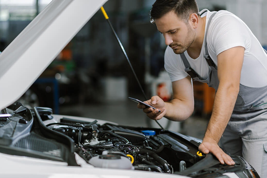 Mechanic talking on phone